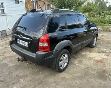 Черный Хендай Туксон, объемом двигателя 2 л и пробегом 270 тыс. км за 6000 $, фото 1 на Automoto.ua