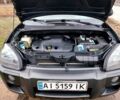 Черный Хендай Туксон, объемом двигателя 2 л и пробегом 272 тыс. км за 7500 $, фото 17 на Automoto.ua