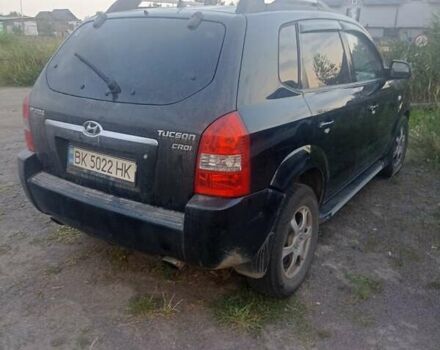 Черный Хендай Туксон, объемом двигателя 1.99 л и пробегом 239 тыс. км за 7700 $, фото 3 на Automoto.ua