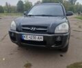 Черный Хендай Туксон, объемом двигателя 2 л и пробегом 193 тыс. км за 8100 $, фото 1 на Automoto.ua