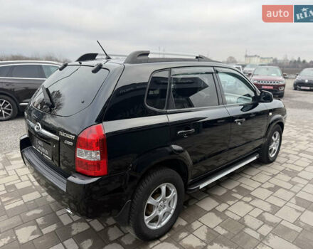 Чорний Хендай Туксон, об'ємом двигуна 2 л та пробігом 240 тис. км за 6888 $, фото 7 на Automoto.ua
