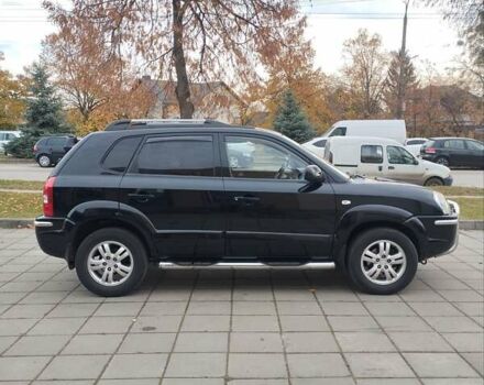 Черный Хендай Туксон, объемом двигателя 1.98 л и пробегом 214 тыс. км за 7700 $, фото 7 на Automoto.ua