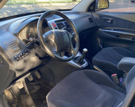 Черный Хендай Туксон, объемом двигателя 1.98 л и пробегом 218 тыс. км за 7200 $, фото 11 на Automoto.ua