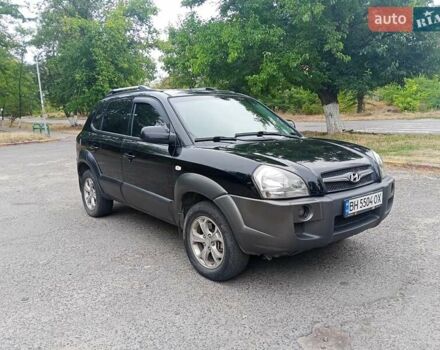 Черный Хендай Туксон, объемом двигателя 1.98 л и пробегом 157 тыс. км за 7500 $, фото 2 на Automoto.ua
