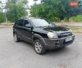 Черный Хендай Туксон, объемом двигателя 1.98 л и пробегом 157 тыс. км за 7500 $, фото 2 на Automoto.ua