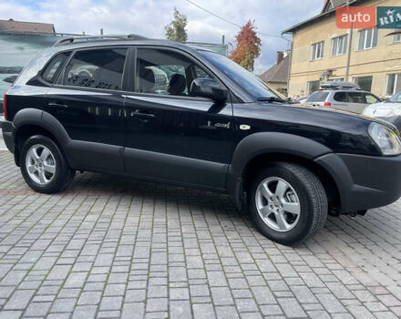 Черный Хендай Туксон, объемом двигателя 1.98 л и пробегом 177 тыс. км за 7600 $, фото 5 на Automoto.ua