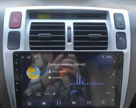 Черный Хендай Туксон, объемом двигателя 1.98 л и пробегом 300 тыс. км за 6800 $, фото 6 на Automoto.ua