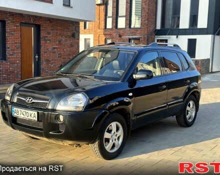 Черный Хендай Туксон, объемом двигателя 2 л и пробегом 225 тыс. км за 8200 $, фото 1 на Automoto.ua