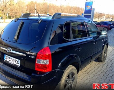 Черный Хендай Туксон, объемом двигателя 2 л и пробегом 240 тыс. км за 8000 $, фото 1 на Automoto.ua