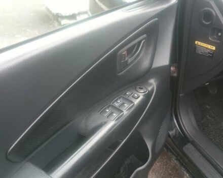 Черный Хендай Туксон, объемом двигателя 1.98 л и пробегом 283 тыс. км за 8800 $, фото 11 на Automoto.ua