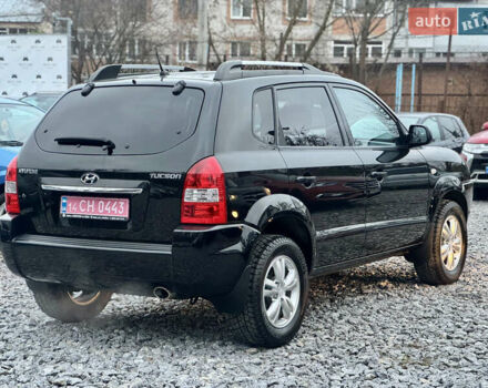 Черный Хендай Туксон, объемом двигателя 1.98 л и пробегом 96 тыс. км за 9900 $, фото 4 на Automoto.ua