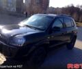 Черный Хендай Туксон, объемом двигателя 2 л и пробегом 240 тыс. км за 8000 $, фото 1 на Automoto.ua