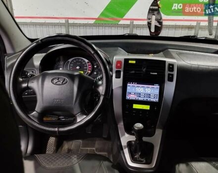 Черный Хендай Туксон, объемом двигателя 2 л и пробегом 221 тыс. км за 8600 $, фото 5 на Automoto.ua