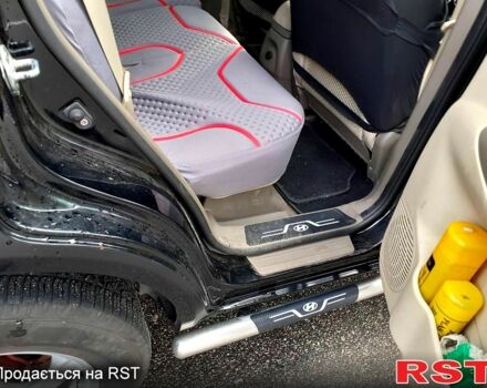 Черный Хендай Туксон, объемом двигателя 2 л и пробегом 240 тыс. км за 7500 $, фото 6 на Automoto.ua