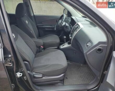 Черный Хендай Туксон, объемом двигателя 2 л и пробегом 237 тыс. км за 7500 $, фото 11 на Automoto.ua