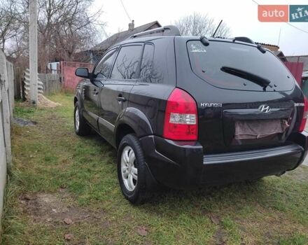 Черный Хендай Туксон, объемом двигателя 2 л и пробегом 237 тыс. км за 7500 $, фото 3 на Automoto.ua