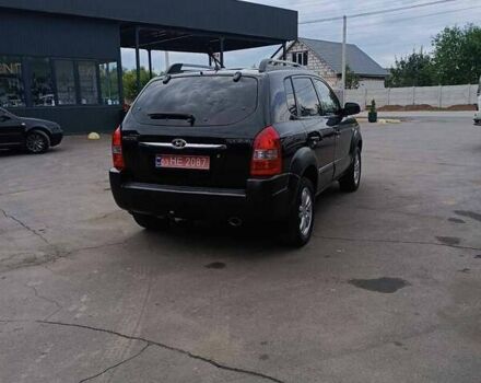 Черный Хендай Туксон, объемом двигателя 2 л и пробегом 255 тыс. км за 8700 $, фото 6 на Automoto.ua