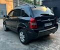 Черный Хендай Туксон, объемом двигателя 2 л и пробегом 245 тыс. км за 6500 $, фото 2 на Automoto.ua