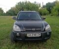 Черный Хендай Туксон, объемом двигателя 2 л и пробегом 440 тыс. км за 8000 $, фото 1 на Automoto.ua