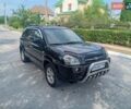 Черный Хендай Туксон, объемом двигателя 2 л и пробегом 260 тыс. км за 6950 $, фото 1 на Automoto.ua