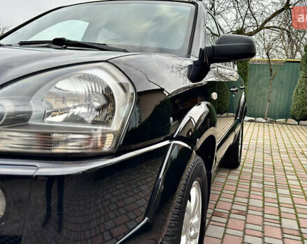 Чорний Хендай Туксон, об'ємом двигуна 2 л та пробігом 182 тис. км за 8299 $, фото 5 на Automoto.ua