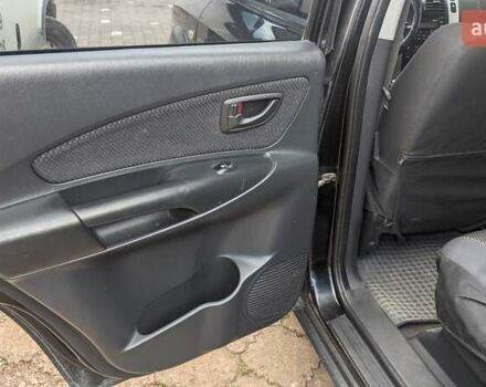 Черный Хендай Туксон, объемом двигателя 2 л и пробегом 163 тыс. км за 8100 $, фото 14 на Automoto.ua