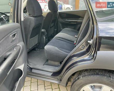 Черный Хендай Туксон, объемом двигателя 1.98 л и пробегом 177 тыс. км за 7600 $, фото 22 на Automoto.ua