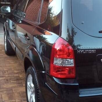 Черный Хендай Туксон, объемом двигателя 2 л и пробегом 187 тыс. км за 8800 $, фото 8 на Automoto.ua