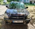Черный Хендай Туксон, объемом двигателя 2.7 л и пробегом 251 тыс. км за 9800 $, фото 1 на Automoto.ua