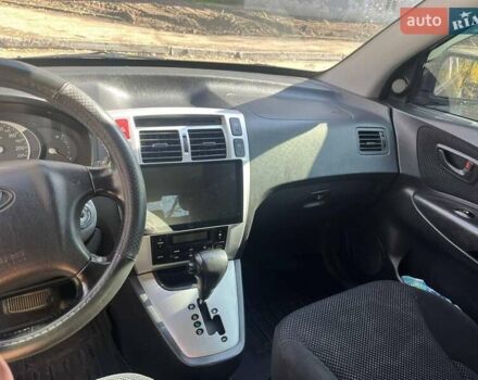 Черный Хендай Туксон, объемом двигателя 2 л и пробегом 250 тыс. км за 8500 $, фото 2 на Automoto.ua