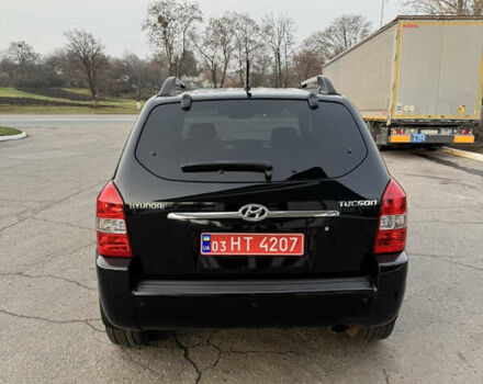 Черный Хендай Туксон, объемом двигателя 2 л и пробегом 210 тыс. км за 7850 $, фото 12 на Automoto.ua