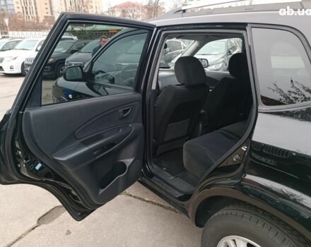 Чорний Хендай Туксон, об'ємом двигуна 2 л та пробігом 192 тис. км за 7990 $, фото 12 на Automoto.ua