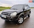 Черный Хендай Туксон, объемом двигателя 1.98 л и пробегом 250 тыс. км за 8950 $, фото 1 на Automoto.ua