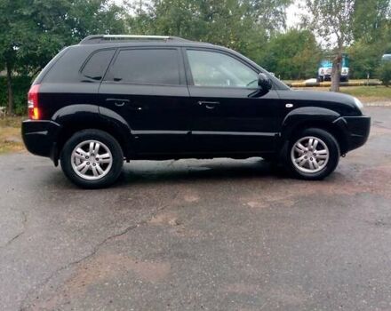 Чорний Хендай Туксон, об'ємом двигуна 2 л та пробігом 225 тис. км за 7850 $, фото 4 на Automoto.ua