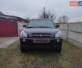 Черный Хендай Туксон, объемом двигателя 2 л и пробегом 237 тыс. км за 7500 $, фото 1 на Automoto.ua