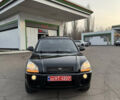 Черный Хендай Туксон, объемом двигателя 2 л и пробегом 210 тыс. км за 7850 $, фото 3 на Automoto.ua