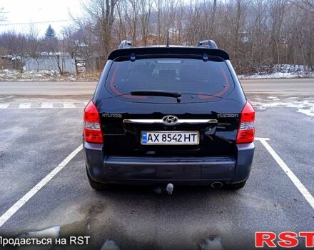 Черный Хендай Туксон, объемом двигателя 2 л и пробегом 140 тыс. км за 8200 $, фото 5 на Automoto.ua