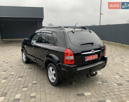 Черный Хендай Туксон, объемом двигателя 2 л и пробегом 198 тыс. км за 7500 $, фото 3 на Automoto.ua