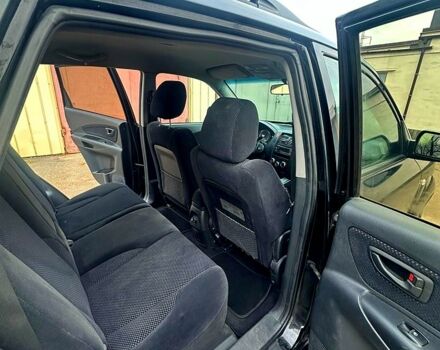 Черный Хендай Туксон, объемом двигателя 2 л и пробегом 215 тыс. км за 6700 $, фото 10 на Automoto.ua