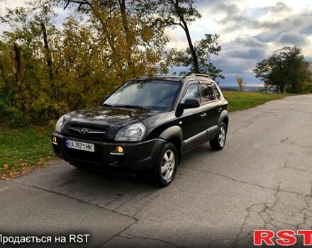 Черный Хендай Туксон, объемом двигателя 2 л и пробегом 220 тыс. км за 8000 $, фото 1 на Automoto.ua