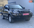 Черный Хендай Туксон, объемом двигателя 2 л и пробегом 220 тыс. км за 8700 $, фото 1 на Automoto.ua