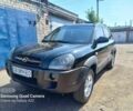 Черный Хендай Туксон, объемом двигателя 2 л и пробегом 190 тыс. км за 7900 $, фото 4 на Automoto.ua