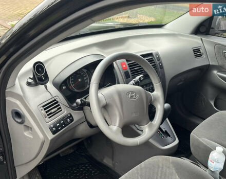 Черный Хендай Туксон, объемом двигателя 2 л и пробегом 107 тыс. км за 8900 $, фото 22 на Automoto.ua