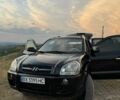 Черный Хендай Туксон, объемом двигателя 2 л и пробегом 323 тыс. км за 9300 $, фото 1 на Automoto.ua
