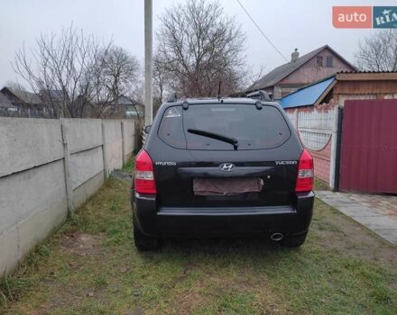 Черный Хендай Туксон, объемом двигателя 2 л и пробегом 237 тыс. км за 7500 $, фото 4 на Automoto.ua