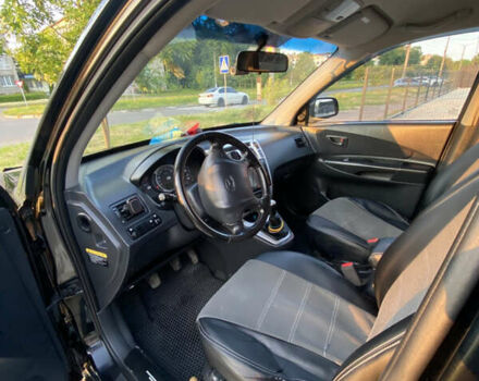 Черный Хендай Туксон, объемом двигателя 1.98 л и пробегом 254 тыс. км за 7700 $, фото 9 на Automoto.ua