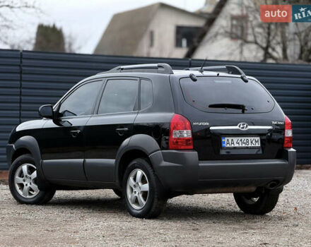 Черный Хендай Туксон, объемом двигателя 2 л и пробегом 252 тыс. км за 7200 $, фото 1 на Automoto.ua