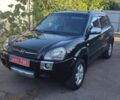 Черный Хендай Туксон, объемом двигателя 2 л и пробегом 214 тыс. км за 8350 $, фото 1 на Automoto.ua