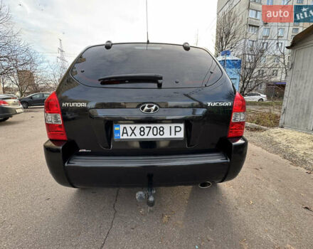 Черный Хендай Туксон, объемом двигателя 1.98 л и пробегом 196 тыс. км за 7999 $, фото 6 на Automoto.ua