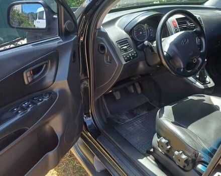 Черный Хендай Туксон, объемом двигателя 1.98 л и пробегом 189 тыс. км за 7800 $, фото 6 на Automoto.ua